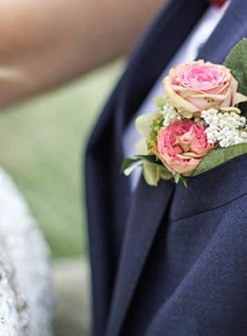 Grooms tuxedo with a boutonniere