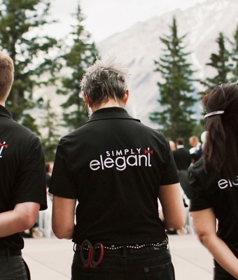 Simply Elegant event planning team in branded shirts at an event in Calgary