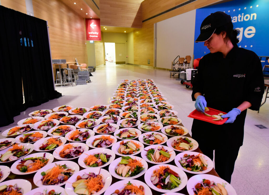 5. Making sure each salad is perfect image on Catered event for CFES at Telus SPARK
